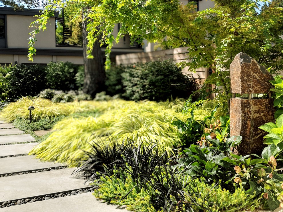 Design ideas for a modern full sun front yard concrete paver garden path in Seattle for summer.