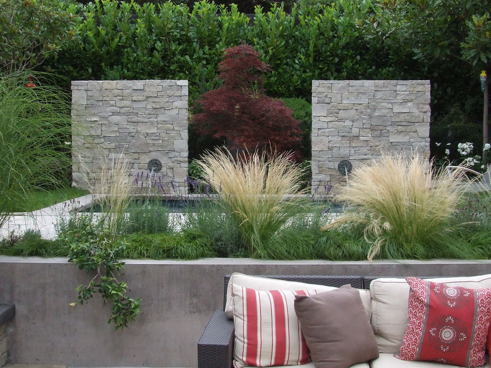 Inspiration for a contemporary garden in Vancouver with a water feature.