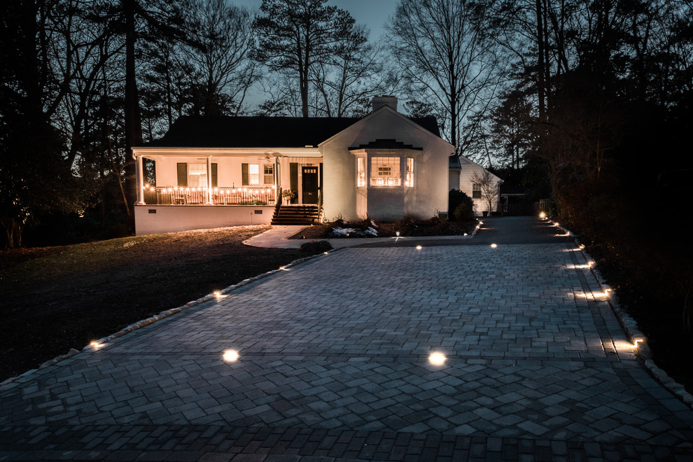 Design ideas for a medium sized classic front driveway full sun garden for summer in Richmond with brick paving.