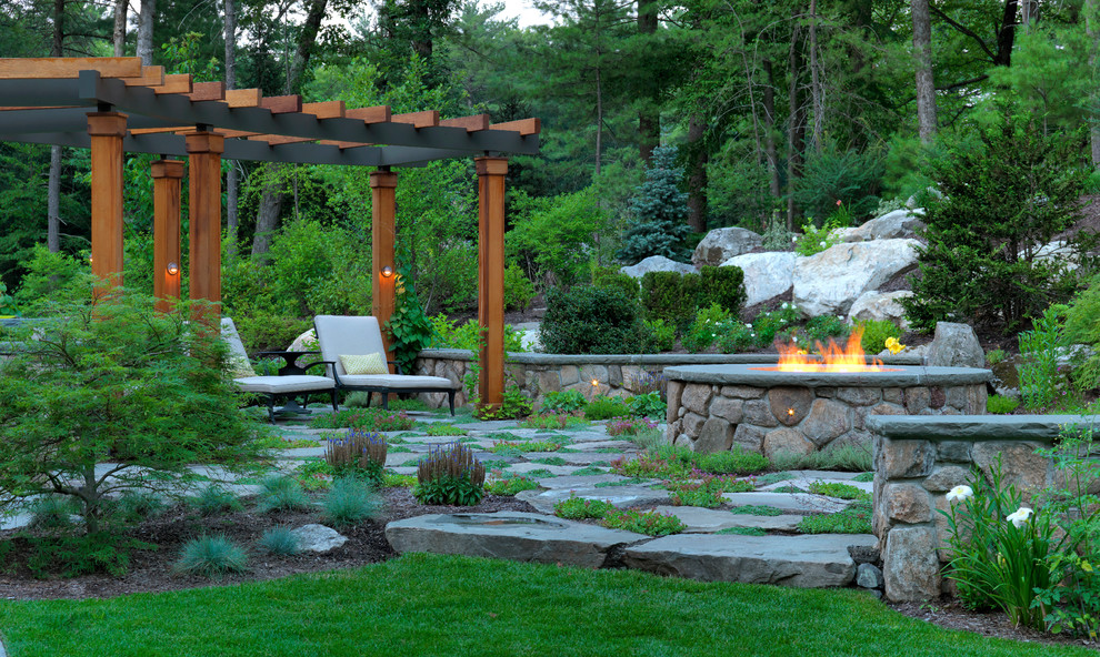 Inspiration for a large classic back pergola in Boston with natural stone paving.