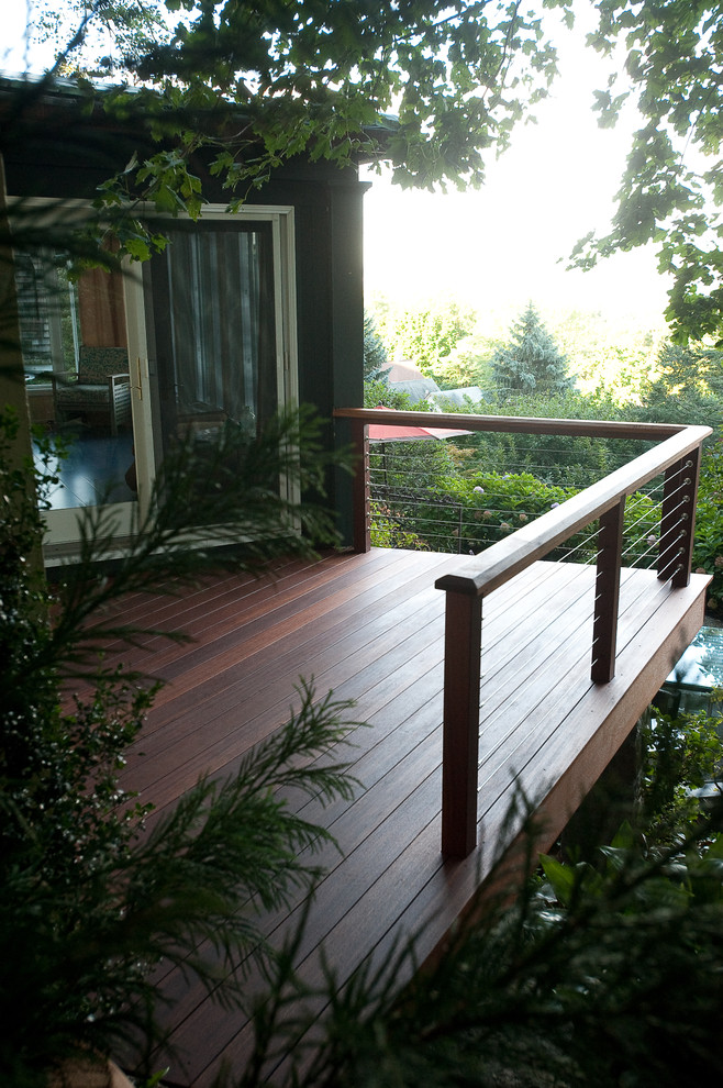 This is an example of a bohemian garden in New York with decking.
