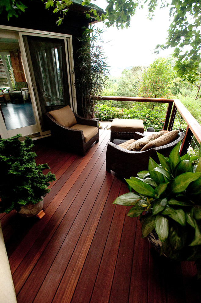Photo of a small eclectic sloped fully shaded garden in New York with decking.