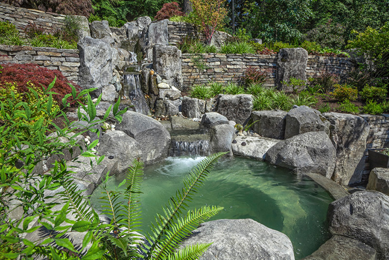 This is an example of a rustic partial sun backyard landscaping in Vancouver.