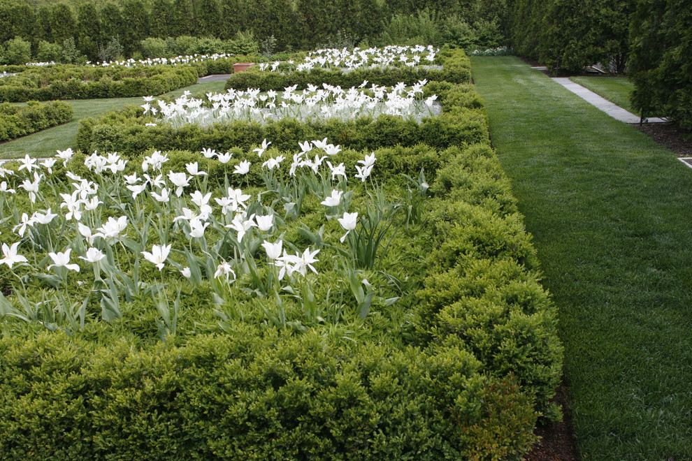 Design ideas for a large traditional backyard formal garden in New York.