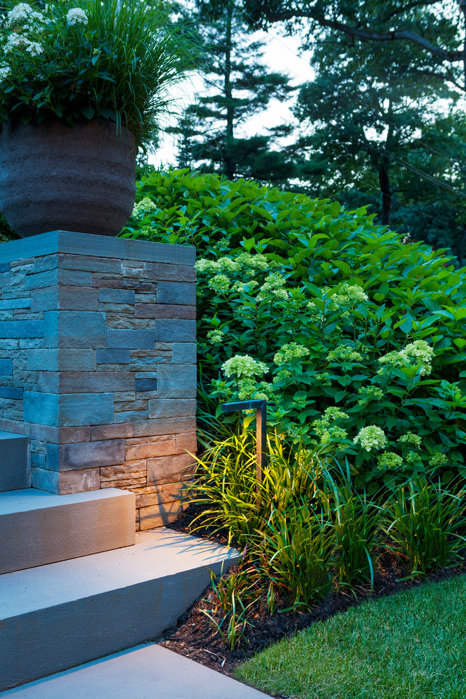 Inspiration for a contemporary front yard stone driveway in Boston.