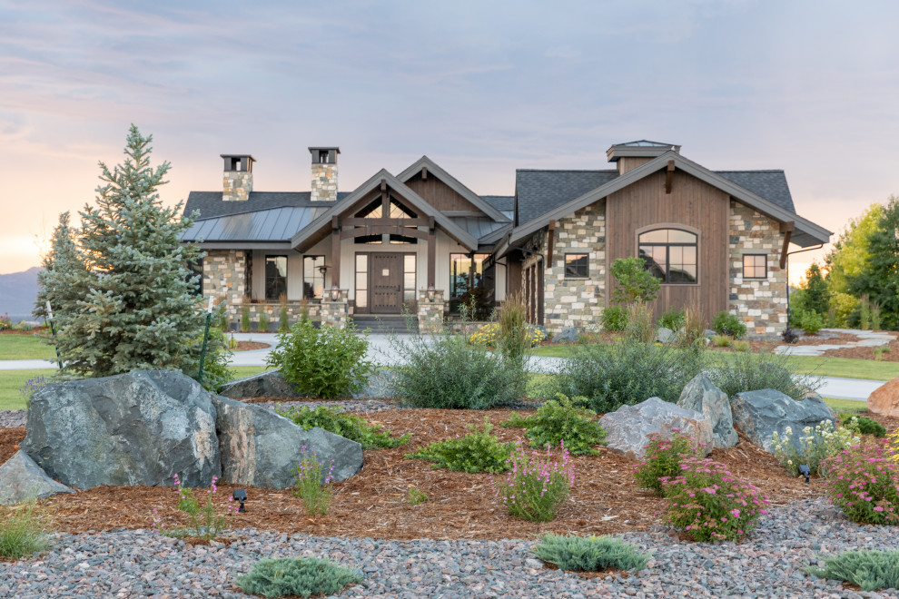 Inspiration for an expansive classic front driveway full sun garden in Denver with a rockery and mulch.