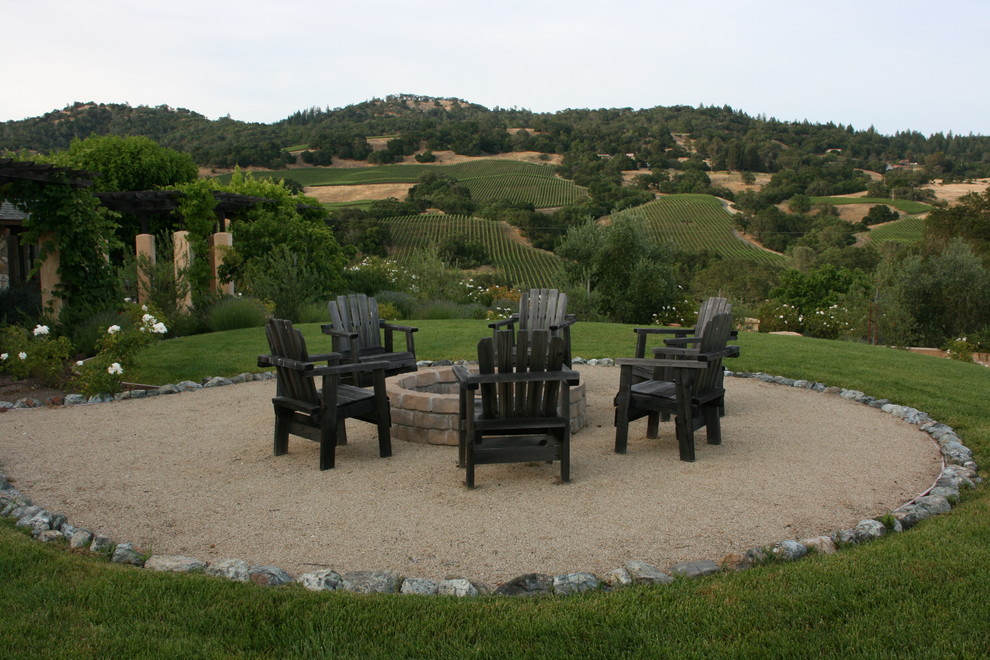 Photo of a mediterranean full sun backyard gravel landscaping in San Francisco.