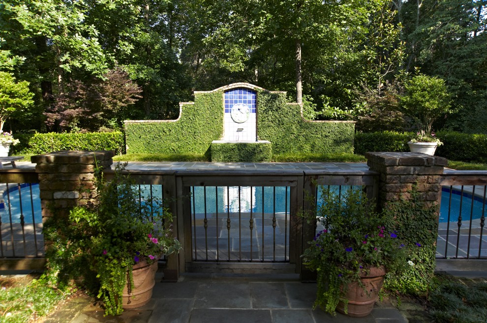 Wood and Iron Fence with outdoor fountain - Traditional - Landscape