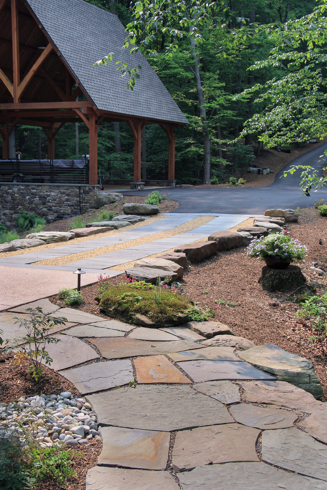 Design ideas for a transitional shade front yard stone garden path in DC Metro for summer.
