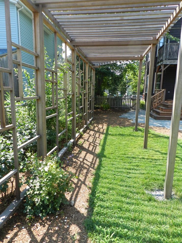 Photo of a contemporary backyard landscaping in Boston with a pergola.