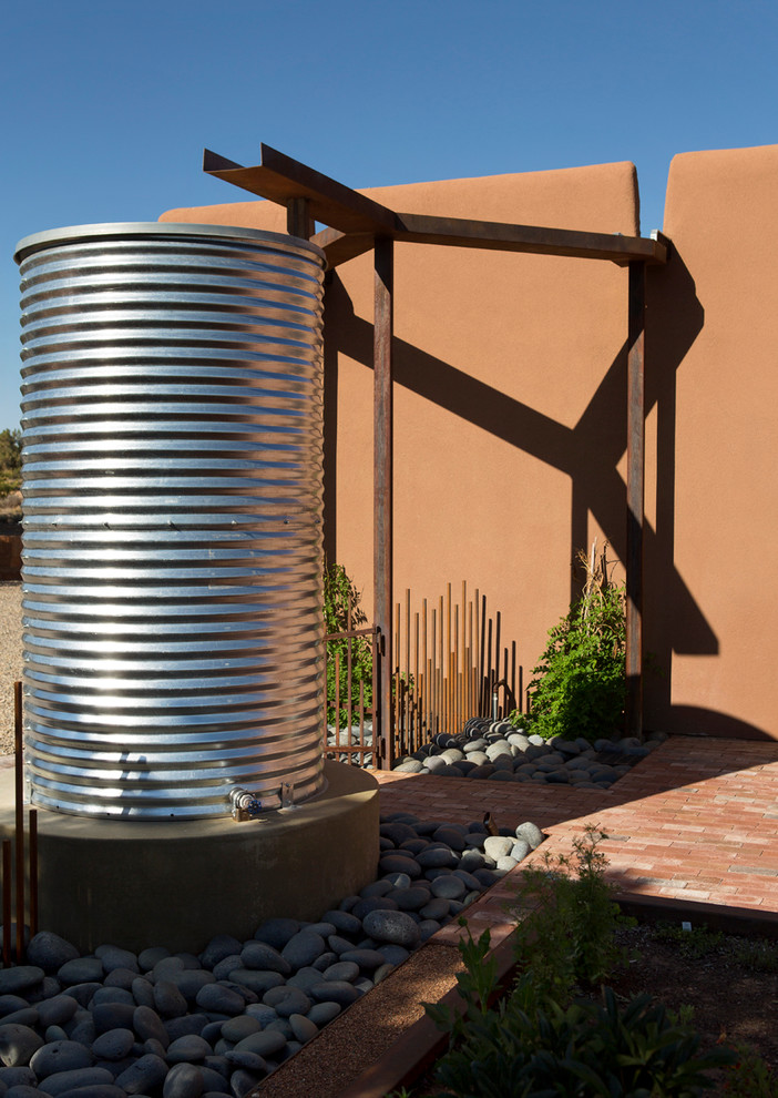 Design ideas for a contemporary drought-tolerant and full sun backyard brick vegetable garden landscape in Albuquerque.