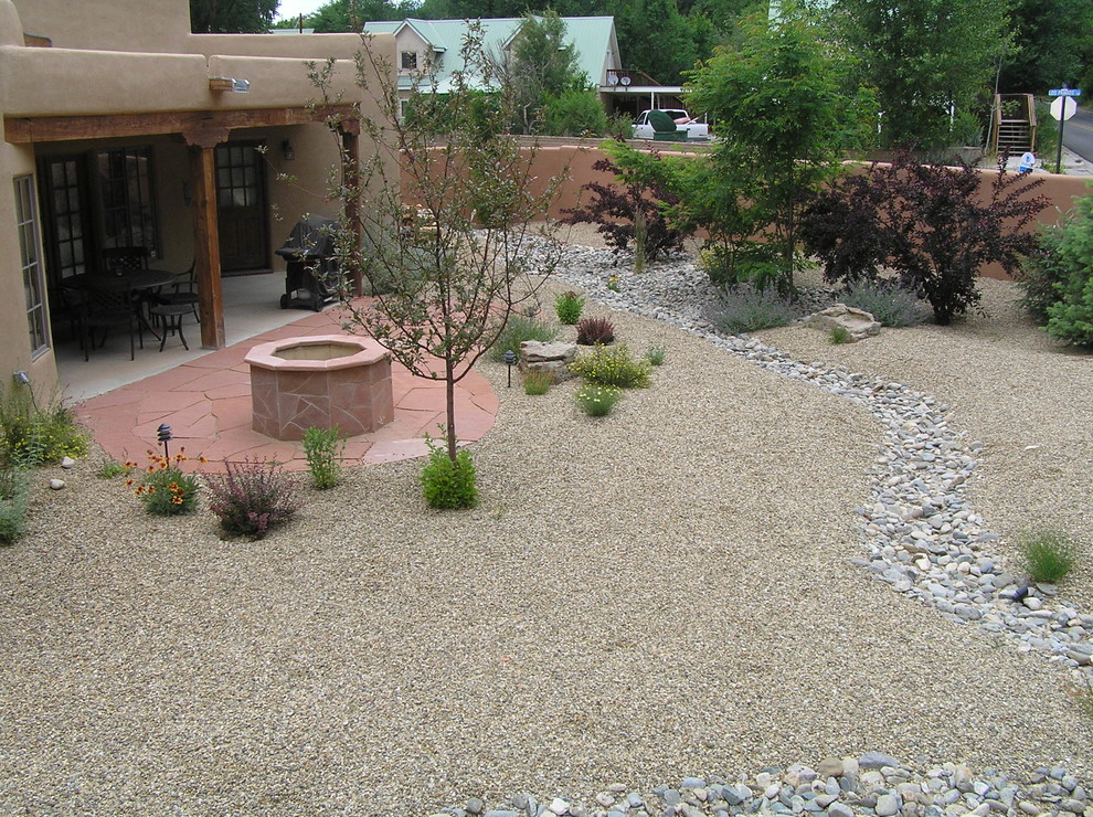 Xeriscape Backyard w/ Flagstone Fire Pit & Dry River Bed for Drainage