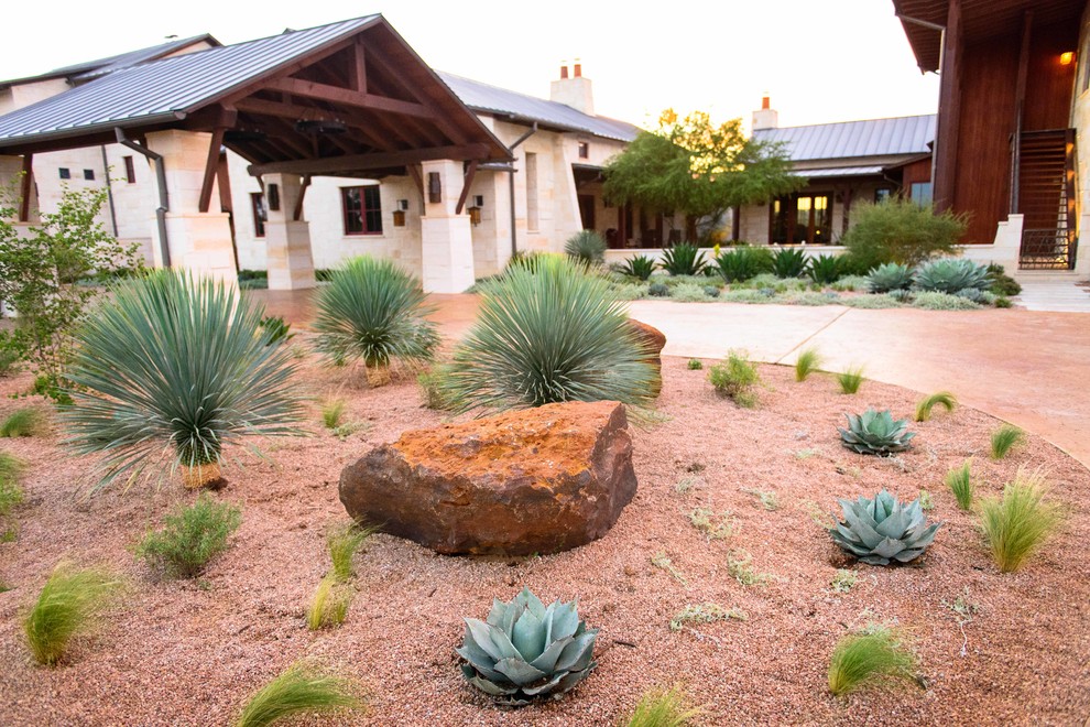 Inspiration for a large southwestern drought-tolerant and full sun courtyard concrete paver garden path in Austin.