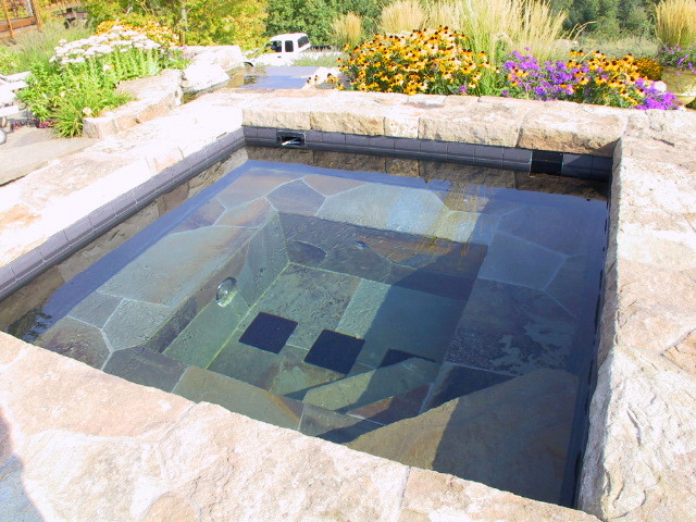 Photo of a large traditional back full sun garden in Portland with natural stone paving.