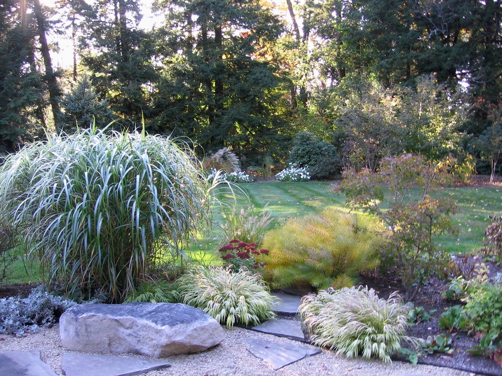 Inspiration for a large asian partial sun front yard gravel landscaping in Boston.