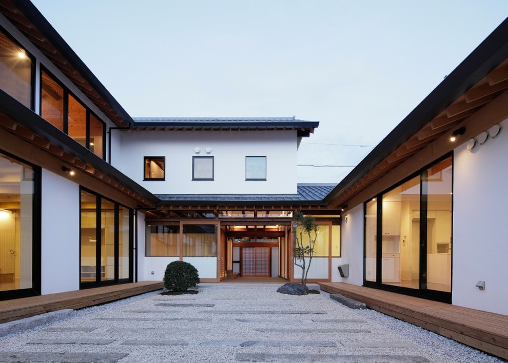 Inspiration for a world-inspired formal partial sun garden in Tokyo Suburbs with gravel.