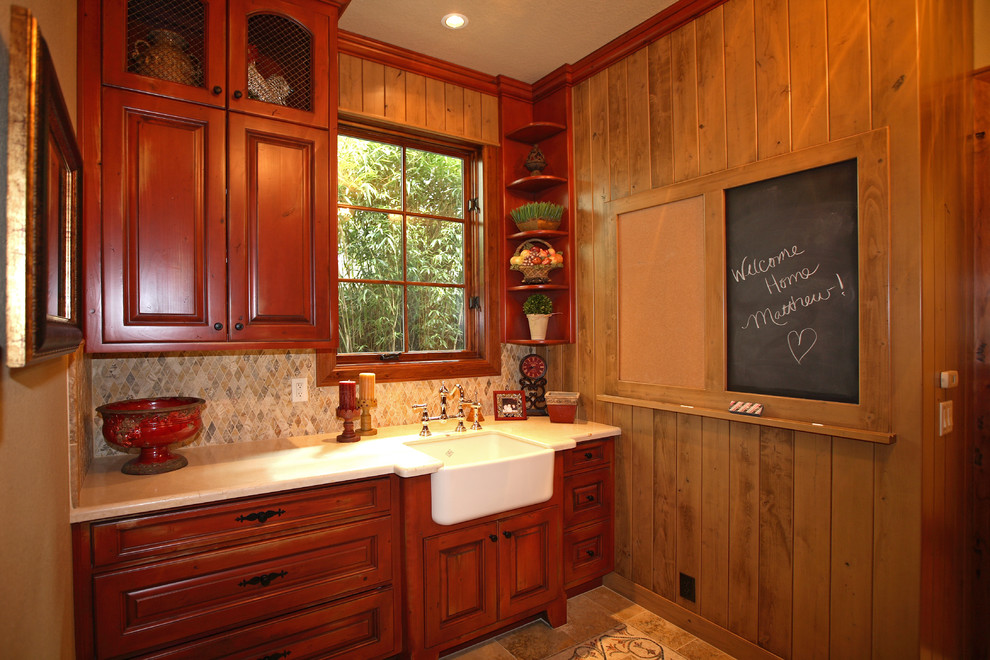 Example of a classic laundry room design in Portland with a farmhouse sink