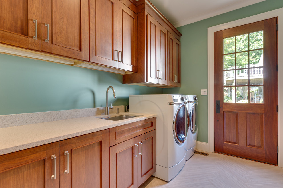 Inspiration for a mid-sized transitional single-wall porcelain tile and beige floor dedicated laundry room remodel in DC Metro with an undermount sink, beaded inset cabinets, medium tone wood cabinets, quartz countertops, beige walls, a side-by-side washer/dryer and beige countertops