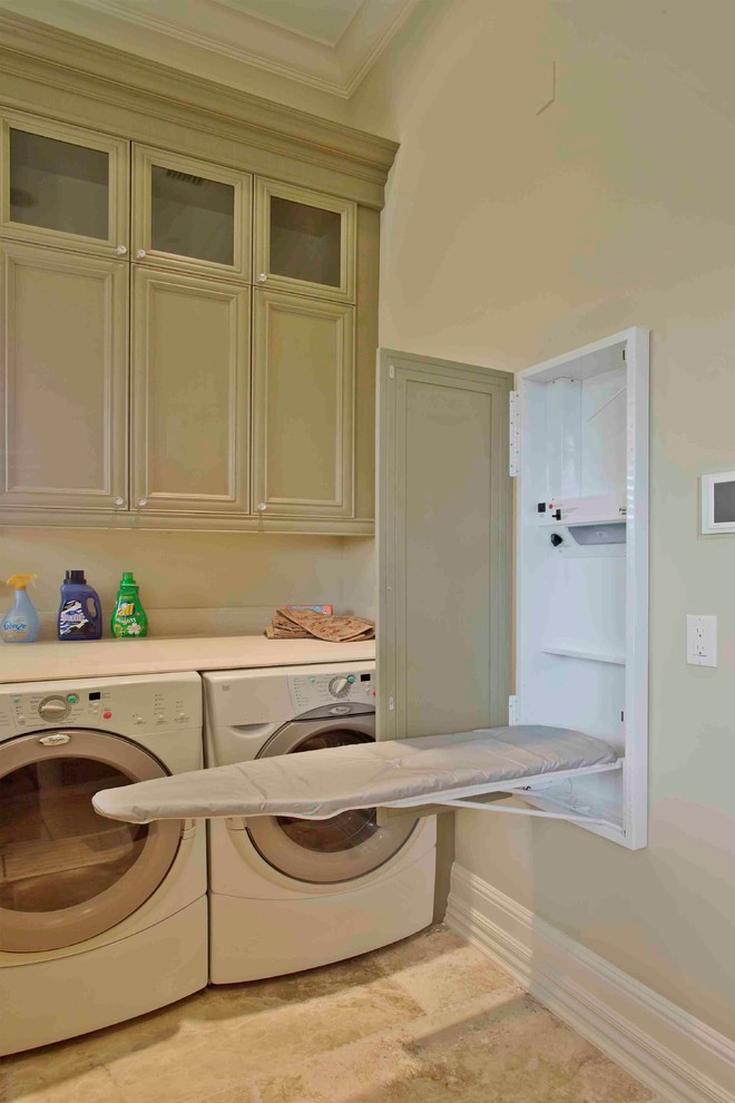 Example of a mid-sized classic single-wall ceramic tile dedicated laundry room design in Orlando with recessed-panel cabinets, green cabinets, laminate countertops, beige walls and a side-by-side washer/dryer