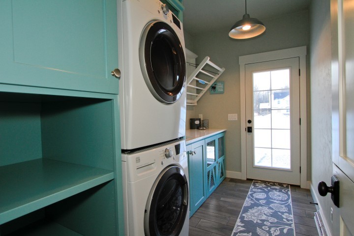 Example of a cottage laundry room design in Other
