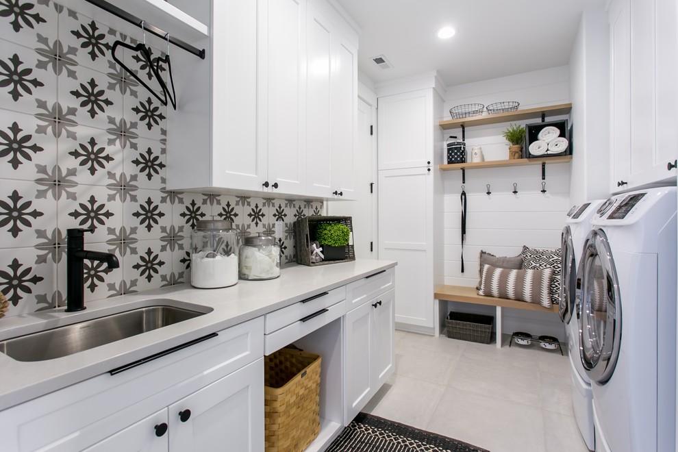 Design ideas for a country utility room in Seattle with a submerged sink, shaker cabinets, white cabinets, white walls, a side by side washer and dryer, grey floors and white worktops.