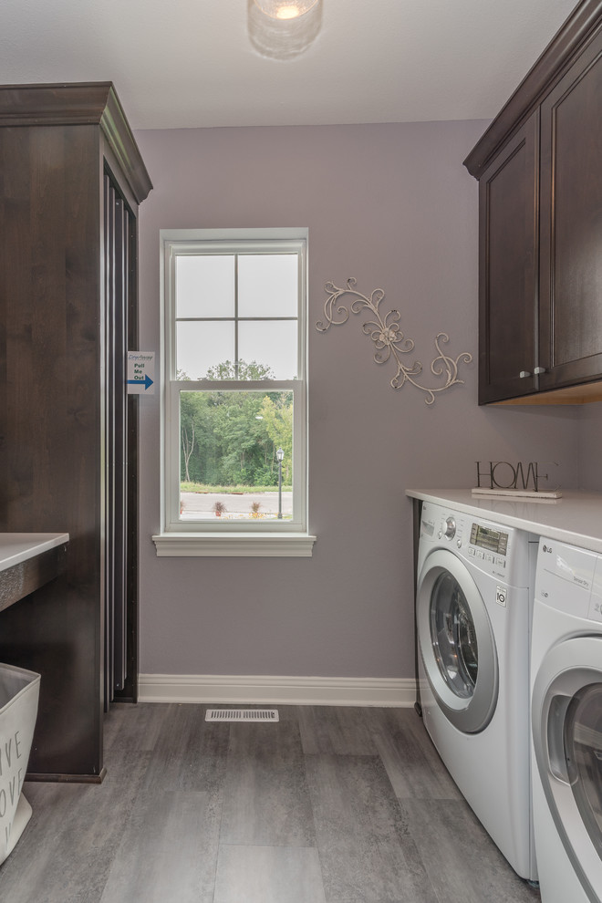 Design ideas for a medium sized classic galley separated utility room in Milwaukee with recessed-panel cabinets, dark wood cabinets, laminate countertops, purple walls, porcelain flooring, a side by side washer and dryer, grey floors and grey worktops.