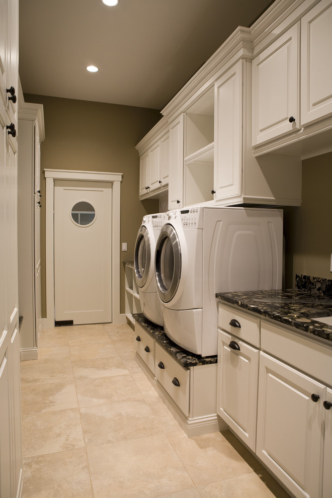 Example of a classic laundry room design in Other