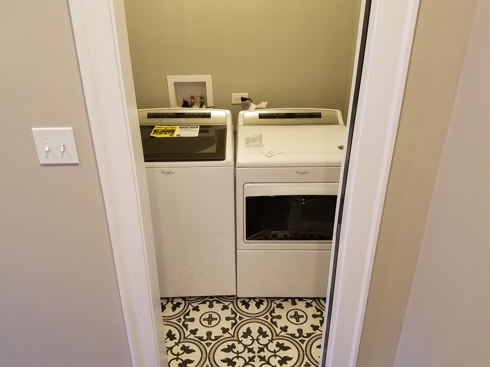 Example of a small classic single-wall ceramic tile and multicolored floor dedicated laundry room design in Chicago with gray walls and a side-by-side washer/dryer