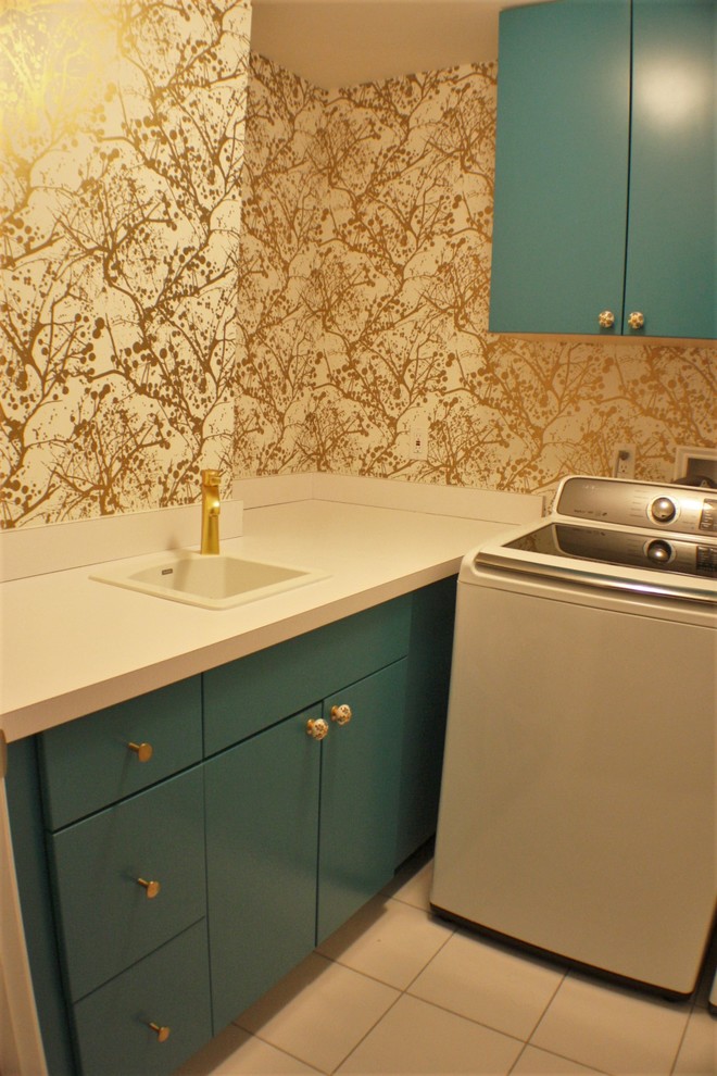 Inspiration for a small bohemian l-shaped separated utility room in Bridgeport with a built-in sink, flat-panel cabinets, laminate countertops, multi-coloured walls, porcelain flooring, a side by side washer and dryer and blue cabinets.