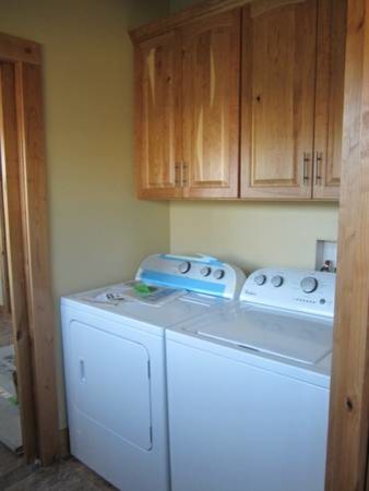 Example of a mountain style laundry room design in Albuquerque