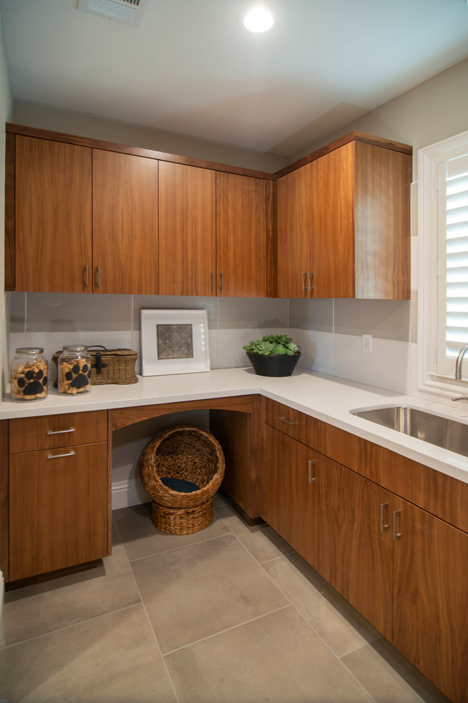 Trendy u-shaped laundry room photo in San Francisco with flat-panel cabinets and medium tone wood cabinets