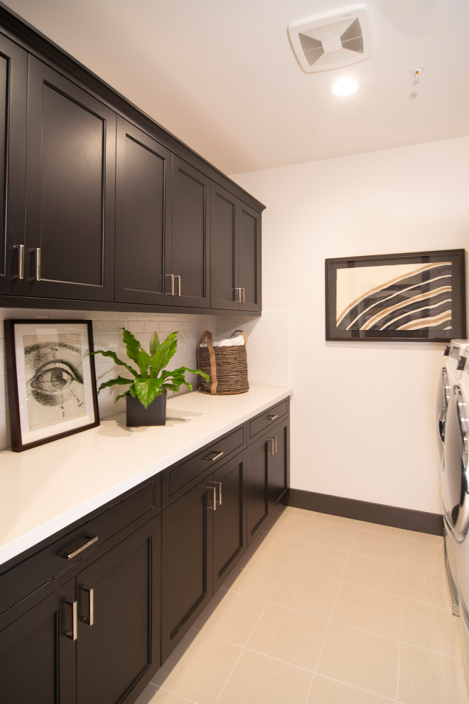 Transitional galley laundry room photo in San Francisco with recessed-panel cabinets and black cabinets