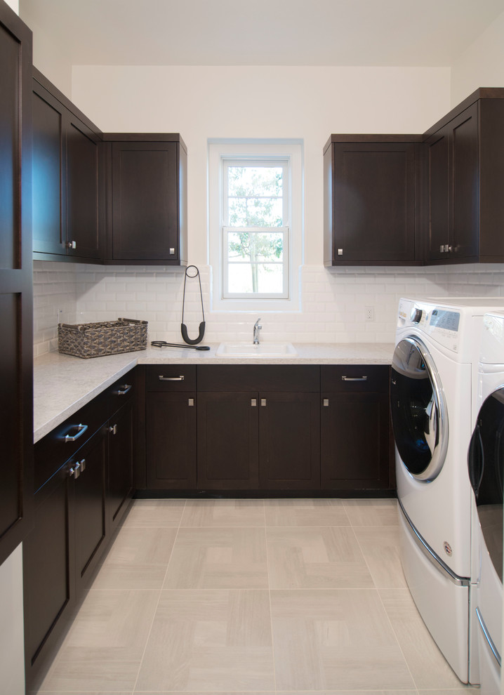 Photo of a classic u-shaped utility room in San Francisco with shaker cabinets and dark wood cabinets.