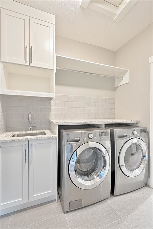 Medium sized contemporary single-wall separated utility room in Calgary with shaker cabinets, white cabinets, green splashback, metro tiled splashback, a submerged sink, granite worktops, grey walls, ceramic flooring and a side by side washer and dryer.