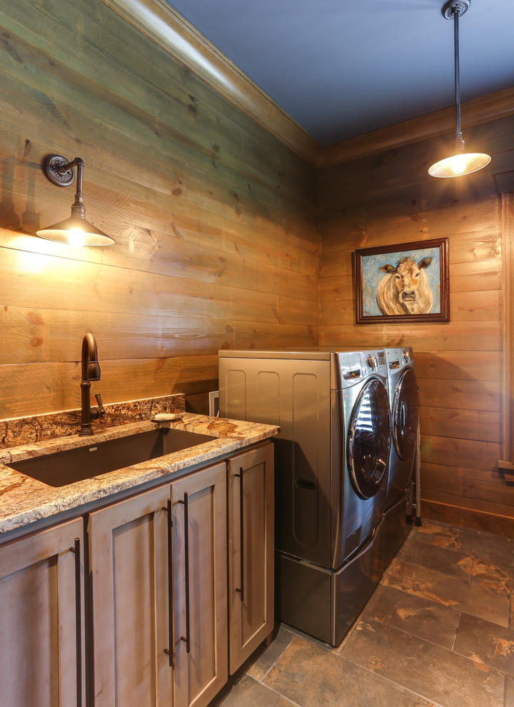 Photo of a medium sized rural l-shaped separated utility room in Raleigh with a submerged sink, shaker cabinets, distressed cabinets, granite worktops, brown walls and ceramic flooring.