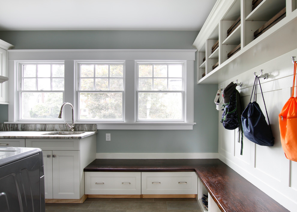 Inspiration for a transitional porcelain tile and gray floor utility room remodel in Newark with blue walls, a side-by-side washer/dryer, an undermount sink, recessed-panel cabinets and white cabinets