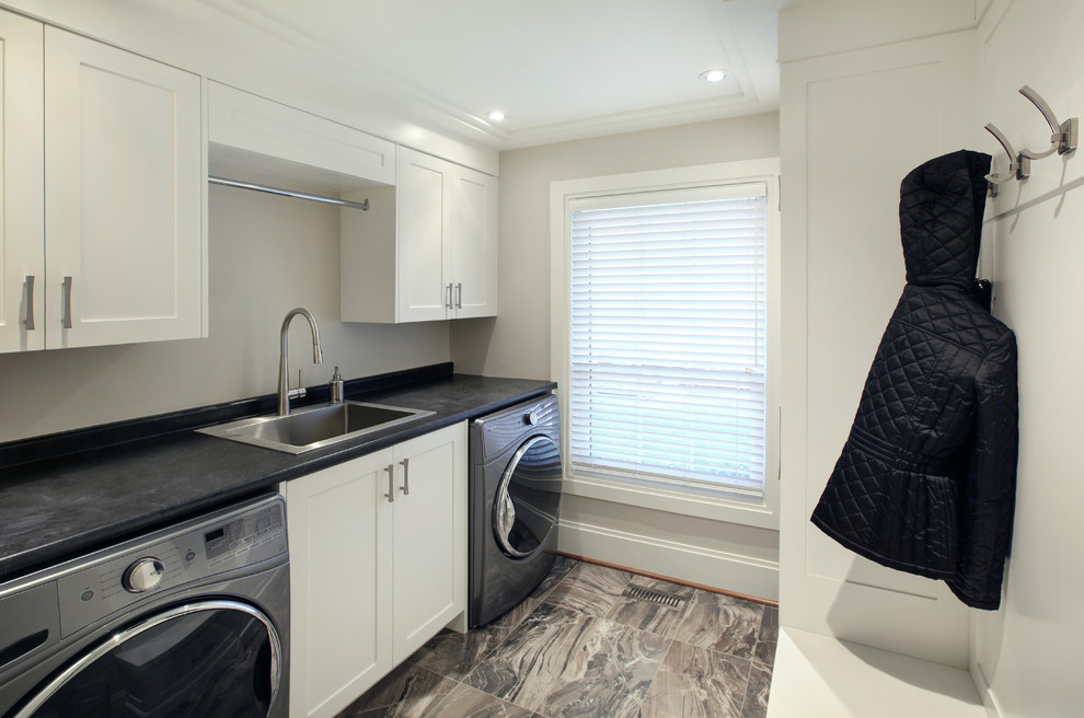 Transitional laundry room photo in Toronto