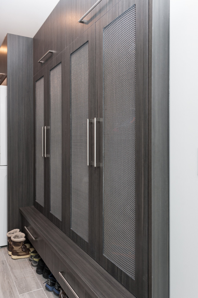 Example of a minimalist l-shaped laundry room design in Salt Lake City with flat-panel cabinets and gray cabinets