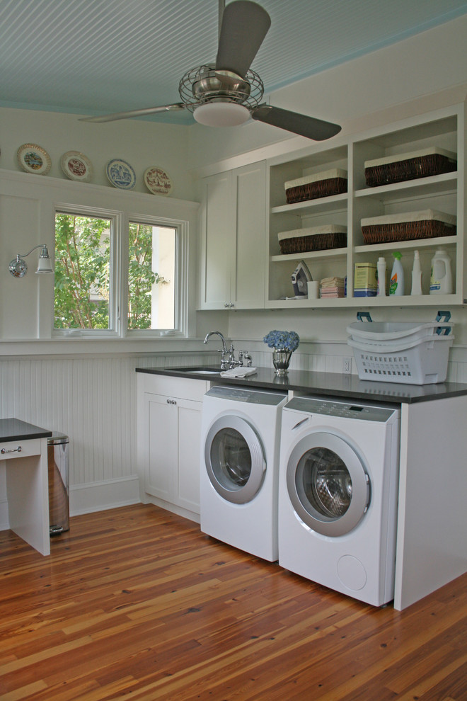 Elegant laundry room photo in Atlanta with white cabinets