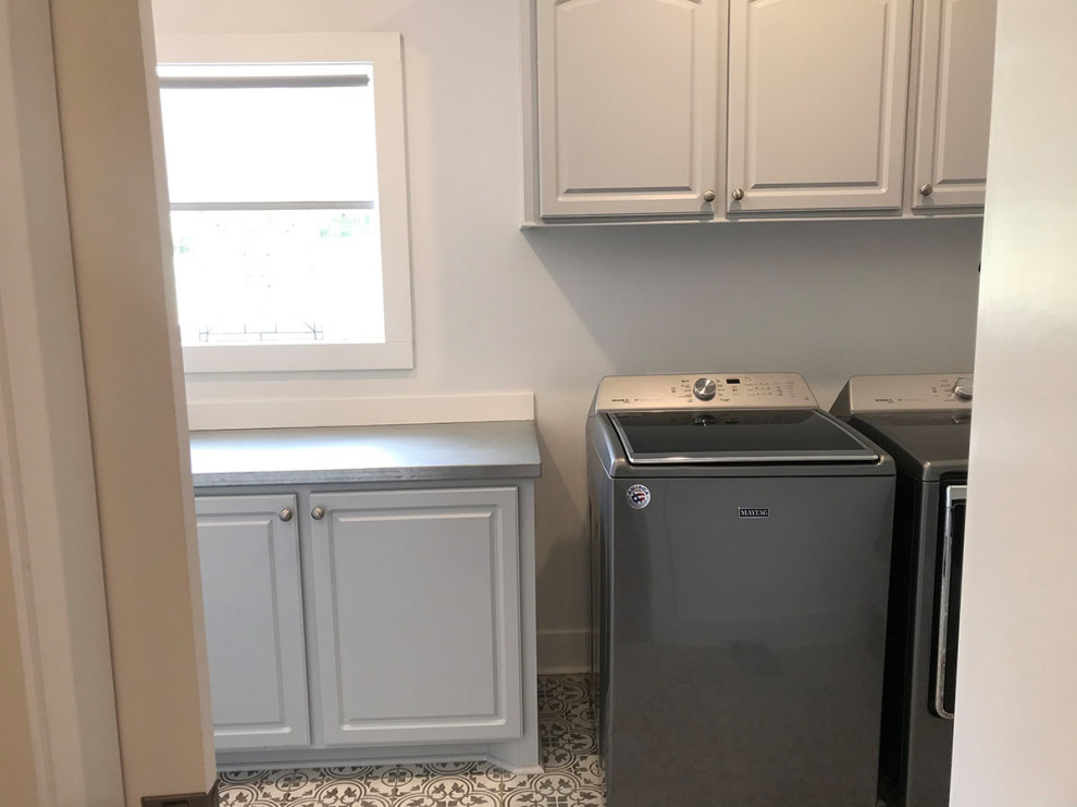 Laundry room - cottage laundry room idea in Other
