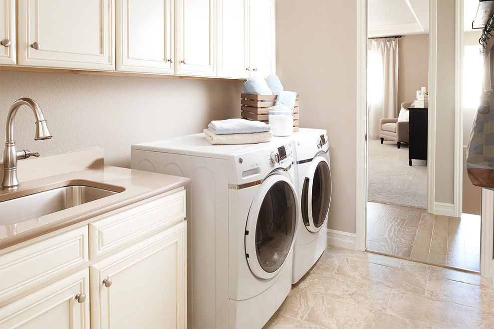 Contemporary separated utility room in Denver with a side by side washer and dryer.