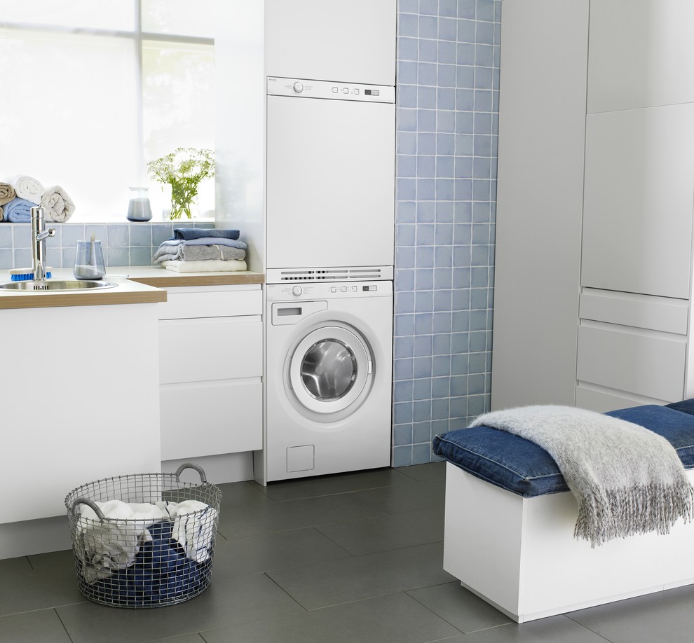Example of a trendy laundry room design in Dallas
