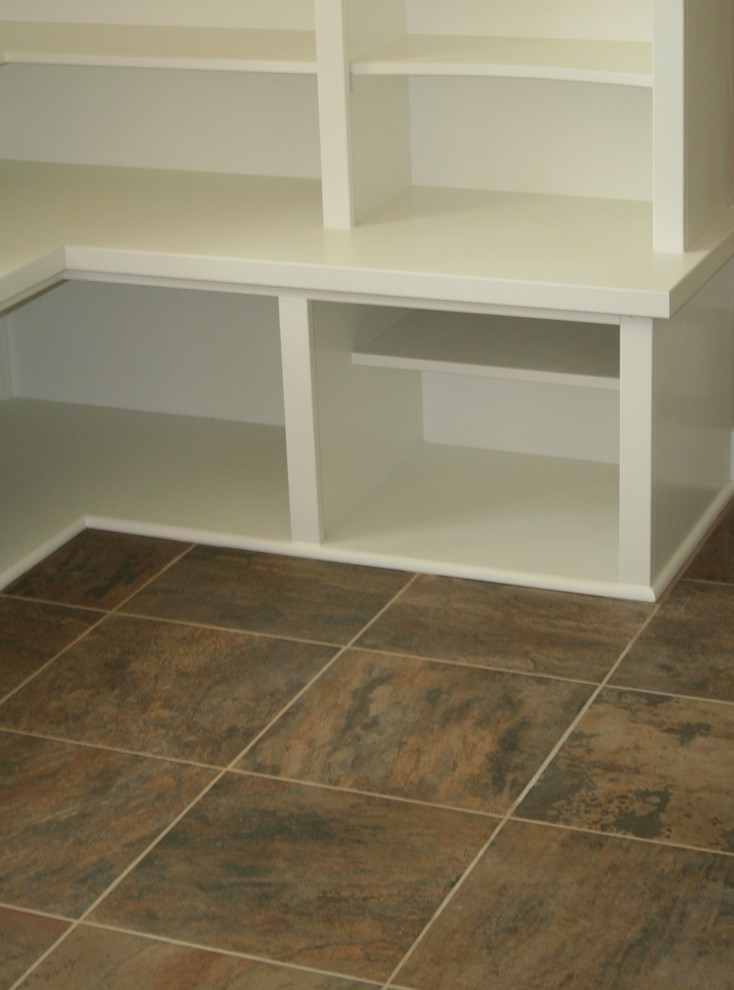 This is an example of a medium sized traditional l-shaped separated utility room in Grand Rapids with open cabinets, white cabinets, wood worktops and slate flooring.