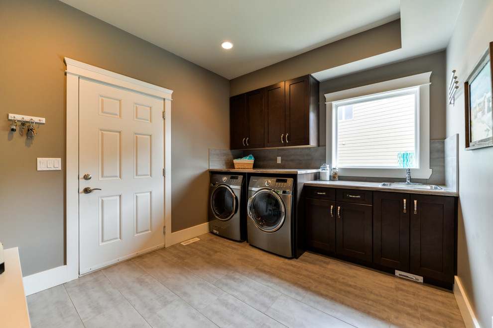 Inspiration for a mid-sized transitional laundry room remodel in Edmonton