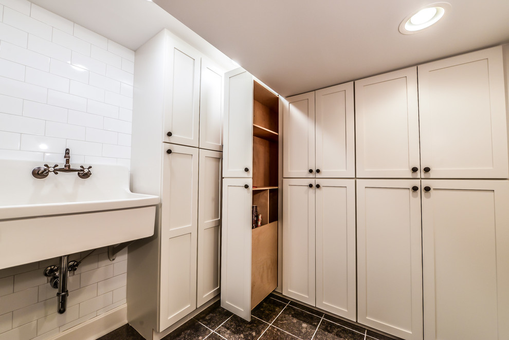 Example of a mid-sized trendy marble floor and black floor utility room design in Cincinnati with shaker cabinets, white cabinets, an utility sink and white walls