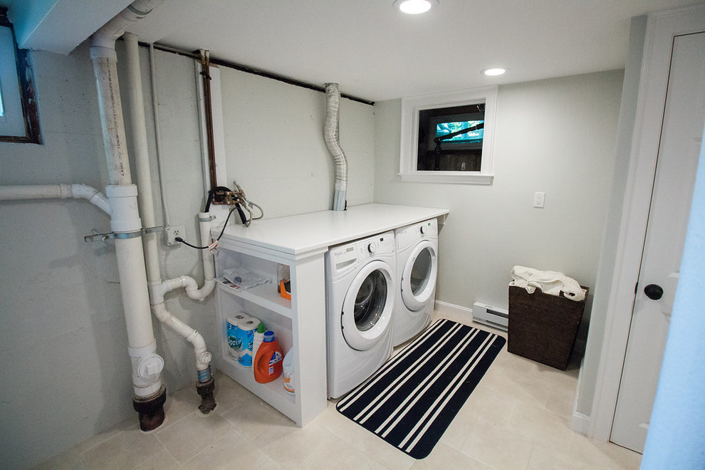 Medium sized traditional single-wall utility room in Boston with composite countertops, beige walls, ceramic flooring and a side by side washer and dryer.