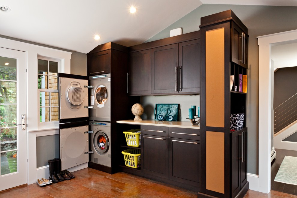 Laundry room - huge transitional ceramic tile laundry room idea in Boston with gray walls