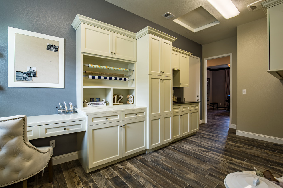 Photo of a country galley utility room in Sacramento with a submerged sink, recessed-panel cabinets, white cabinets, quartz worktops, blue walls and a side by side washer and dryer.