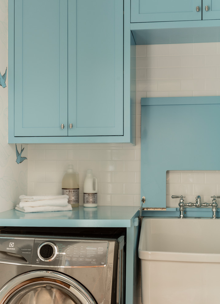 Inspiration for a small traditional single-wall separated utility room in Boston with an utility sink, shaker cabinets, blue cabinets, wood worktops, white walls, medium hardwood flooring, a side by side washer and dryer, brown floors and blue worktops.