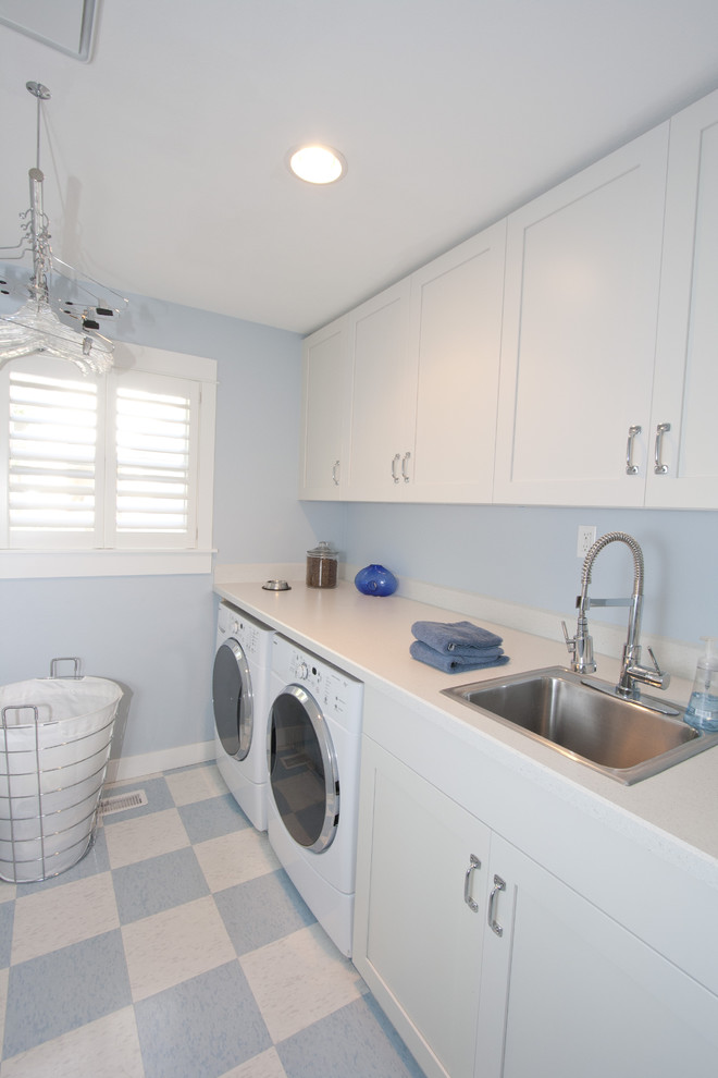 Photo of a classic utility room in Portland with a built-in sink, a side by side washer and dryer, multi-coloured floors and white worktops.